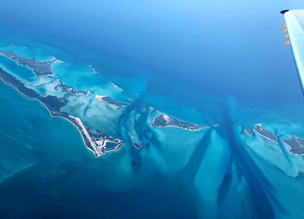 View of the ocean and land from an airplane