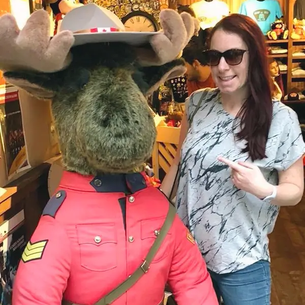 Amanda with a giant fluffy toy moose